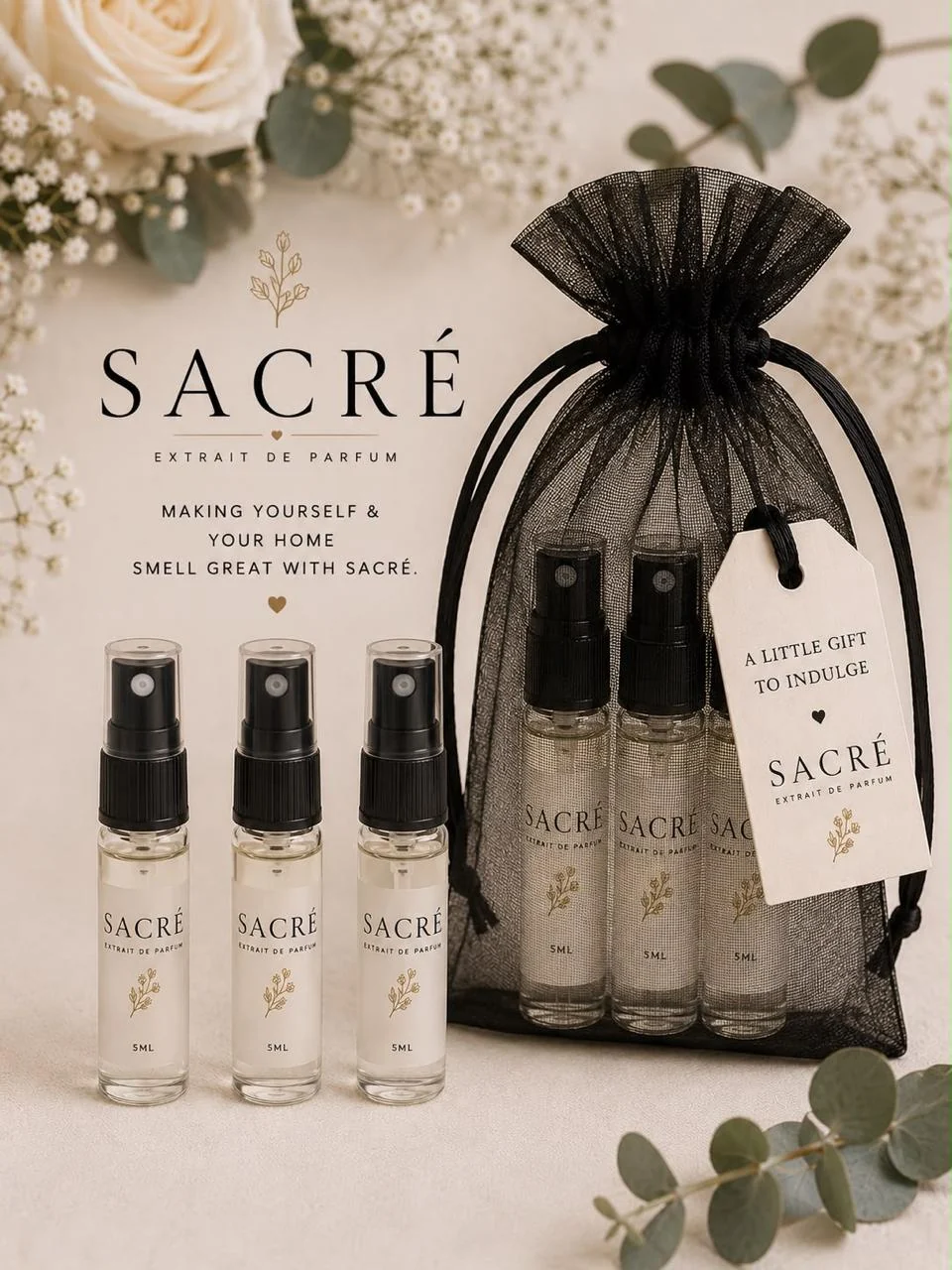 Three complimentary SACRÉ Extrait De Parfum samples presented in a gift bag